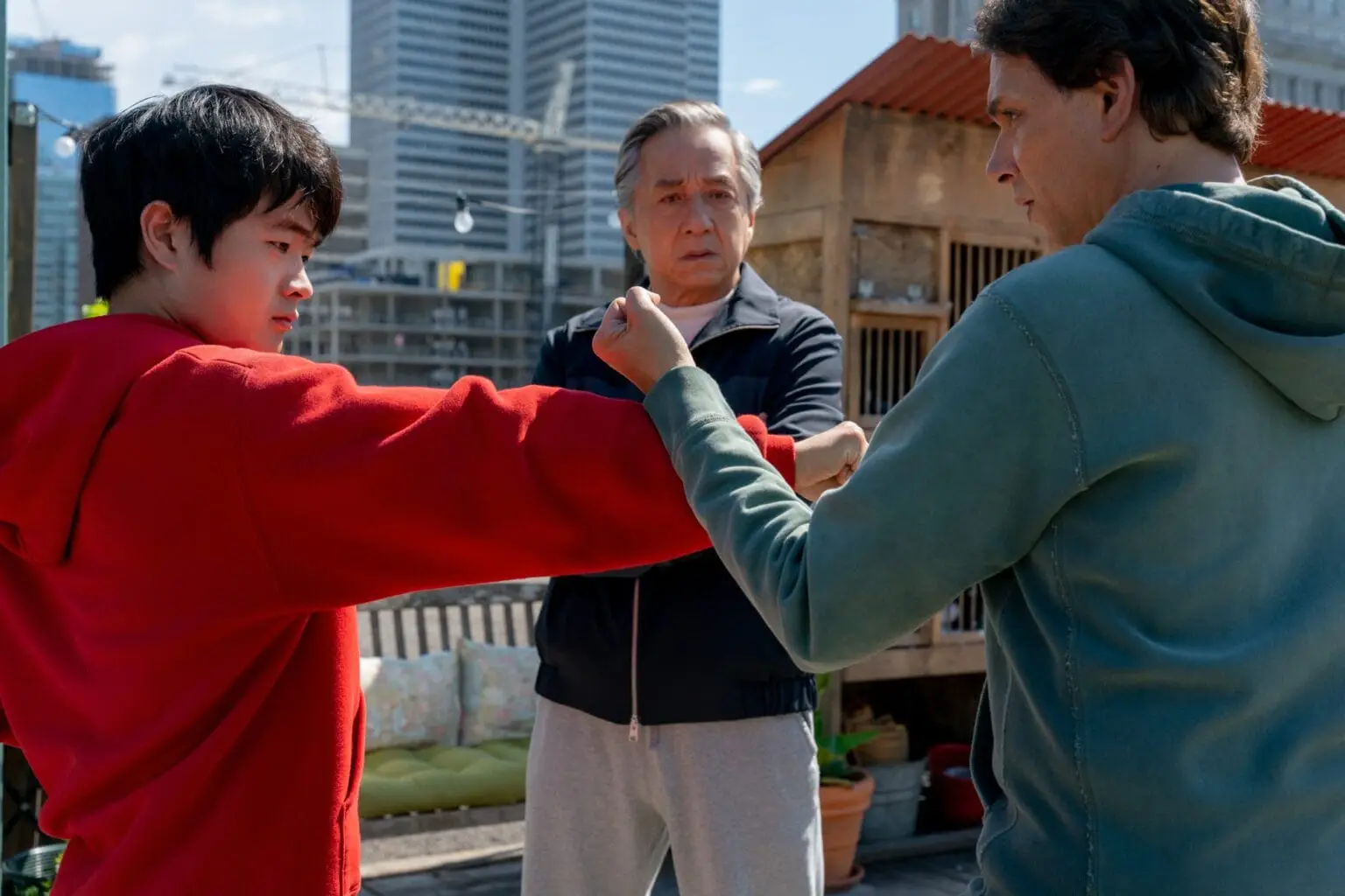 Mr Han (Jackie Chan) and Daniel LaRusso (Ralph Macchio) train Li in Karate kids legends