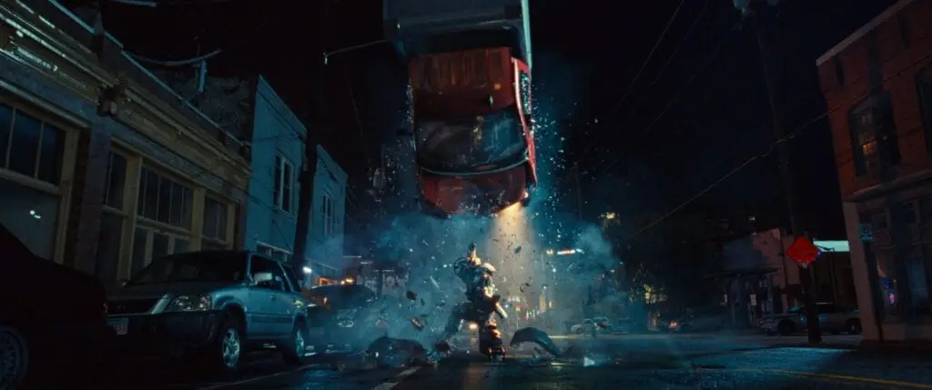 Ironheart smashes a truck. All rights reserved to Marvel Studios, Marvel Television, and Disney.