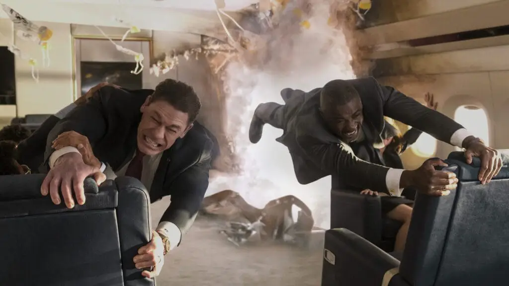 John Cena and Idris Elba hang on for dear life as Air Force One gets blown apart mid-flight — one of the film’s most over-the-top (and oddly entertaining) set pieces. Image credit: Amazon MGM Studios / Prime Video – from our Heads of State review