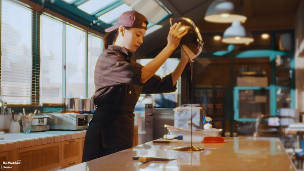 Still of Hana making chocolates. Image © Netflix / YONG FILM / YONGFILM JAPAN